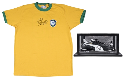 Lot of (2) Pele Signed Puma Cleat in Glass Display Case & Replica Brazil National Team Shirt (PSA/DNA)